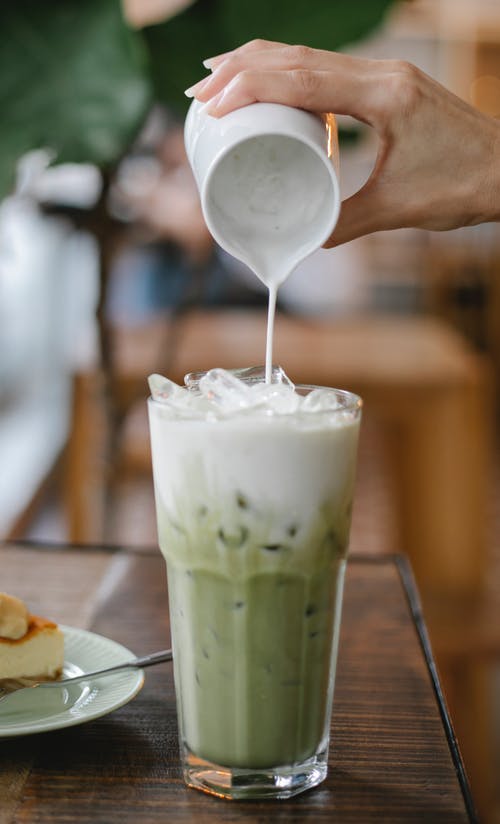 matcha poured into tall glass with ice
