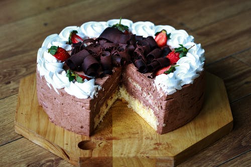 chocolate cake with whipped cream and berries